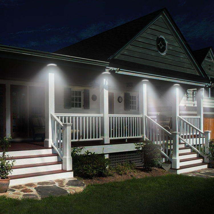 Outdoor front-porch solar wall lights glowing above steps and railings