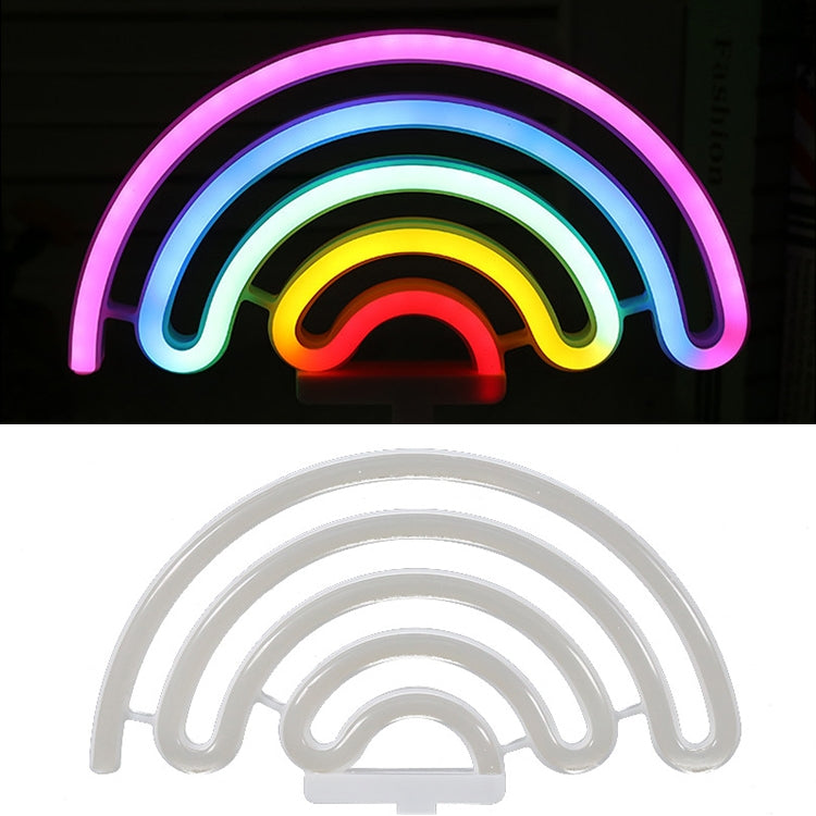 Rainbow neon night light with glowing concentric rainbow arcs on white base
