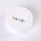 Rainbow neon light internal battery terminals inside white round housing