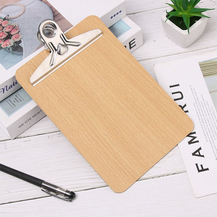 Wooden writing clipboard with metal clip holding papers and pen