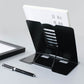 Black metal adjustable reading book stand with slotted page holders and base