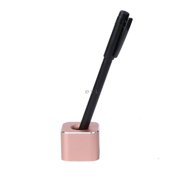 Rose gold metal single-slot pen stand holding a black pen