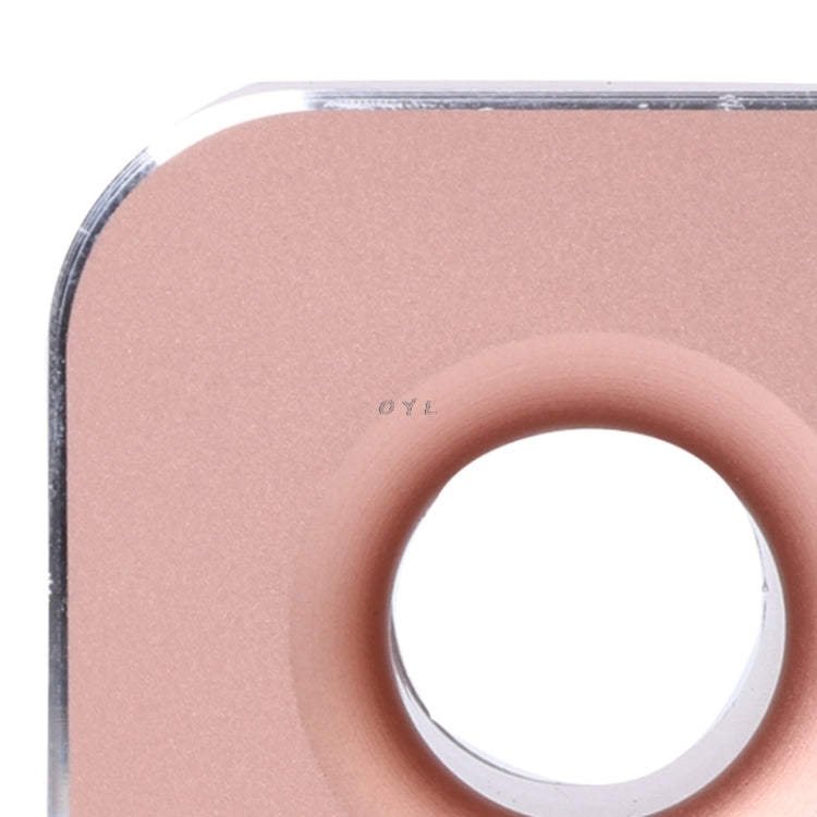 Close-up of rose gold metal pen holder’s circular slot opening