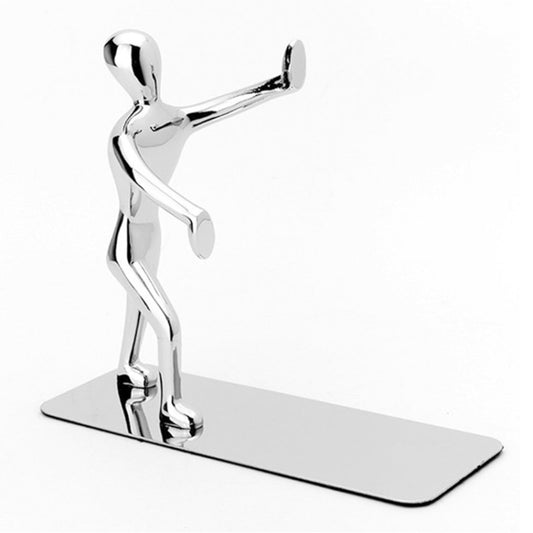 Chrome humanoid book holder figure standing on a flat desk base.