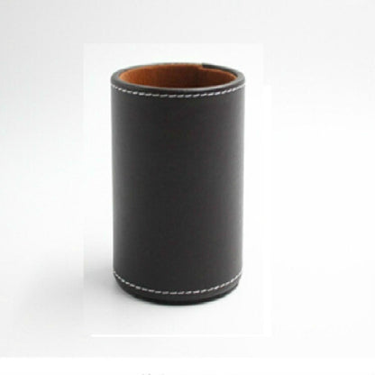 Black faux-leather pen holder organizer, round cylinder with tan lining and stitched rim.