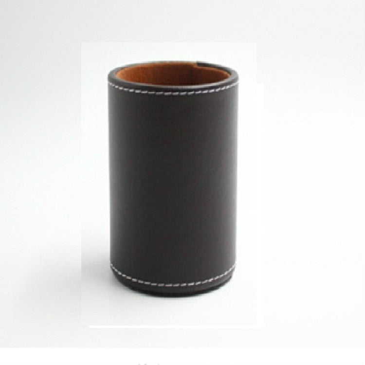 Black faux-leather pen holder organizer, round cup with tan interior and stitched base.
