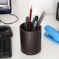 Brown faux-leather pen holder organizer on desk, holding pencils, pen, ruler, and markers.