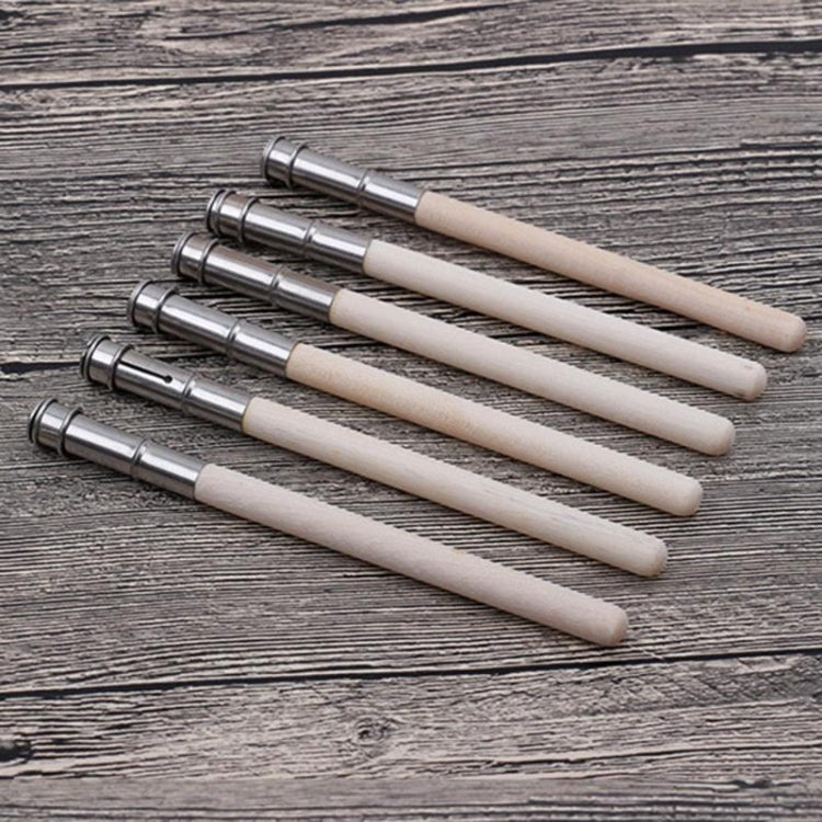 Wood pencil extenders with silver metal ferrules on light wood bodies