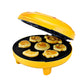 Mini double-sided baking machine, yellow lid open to reveal round and star-shaped cavities