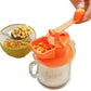 Manual soybean juicer hopper with orange press, soybeans over clear jug
