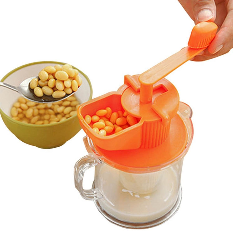 Manual soybean juicer hopper with orange press, soybeans over clear jug