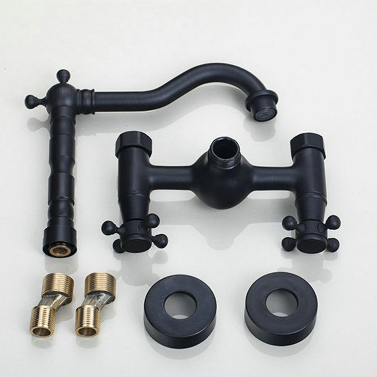 Wall-mounted faucet set in black finish with spout, cross handles, mounting parts and adapters