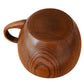 Brown wooden mug cup with handle, rounded bowl, wood grain texture