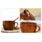 Pair of brown wooden cups with handles, wood grain finish