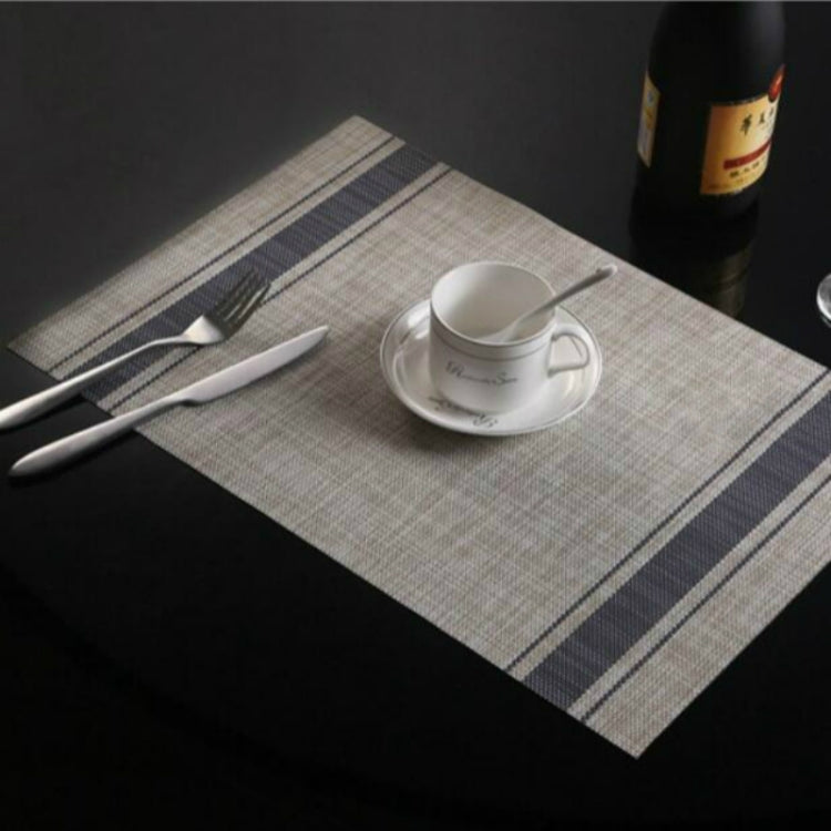 Braided PVC table mat with navy stripe border and checkered center, 30x45cm