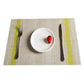Braided PVC table mat in beige with lime green stripe border