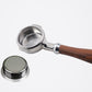 Bottomless portafilter with wooden handle and filter basket, plus spare mesh insert