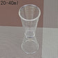 Large double-headed graduated measuring cup, clear plastic hourglass shape with ml/oz lines