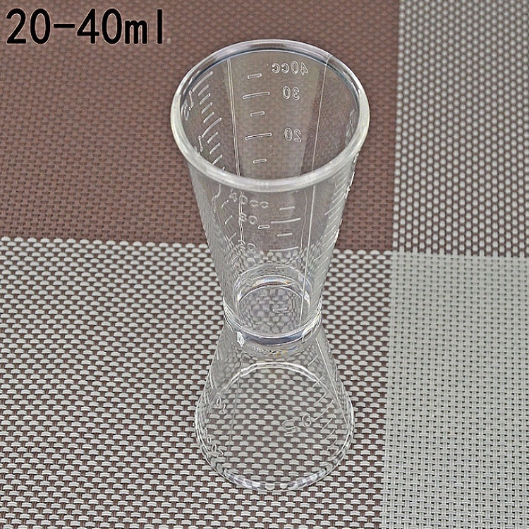 Large double-headed graduated measuring cup, clear plastic hourglass shape with ml/oz lines