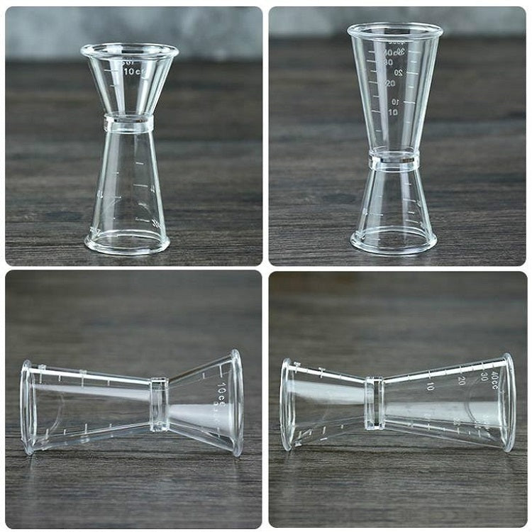 Large double-headed graduated measuring cup, clear plastic shown from different angles