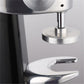 Stainless steel tamper plate and central piston on a coffee press machine