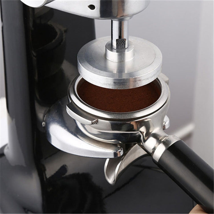 Coffee tamper press close-up with circular metal plate and powder chamber