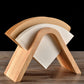 Wooden V-shaped coffee filter holder displaying white paper filters