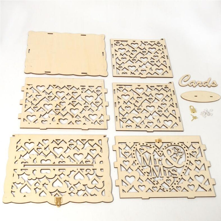 Wooden wedding card box panels with heart cutouts and small “Mr & Mrs” plaques