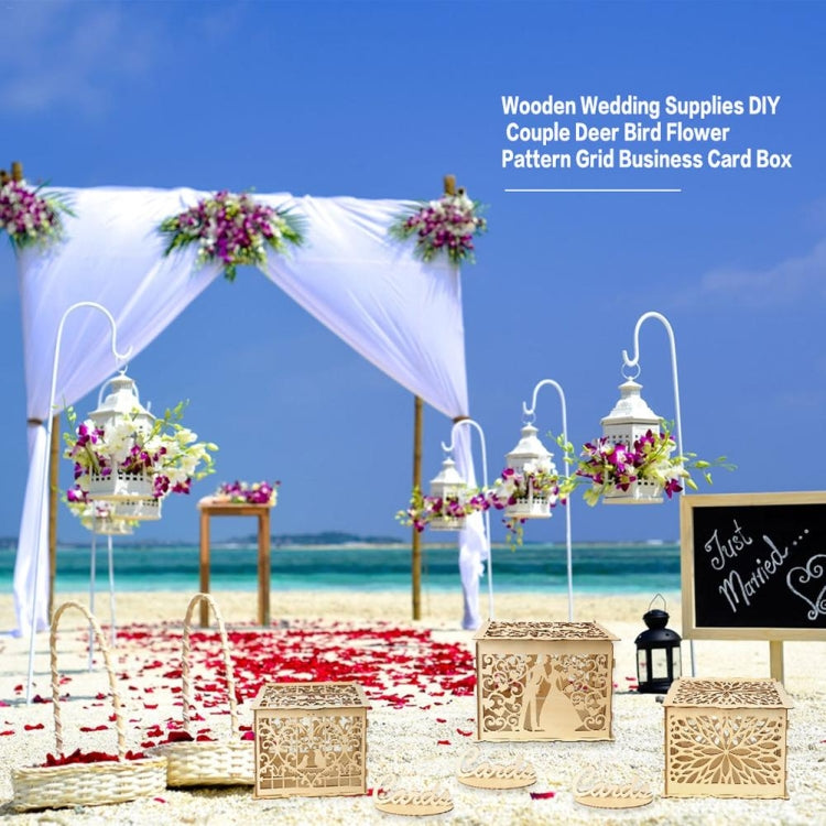 Multiple wooden wedding card boxes with heart cutouts displayed outdoors