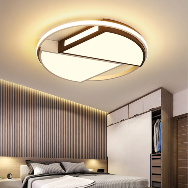 Warm white ceiling lamp with circular ring and black-and-wood geometric inner bars
