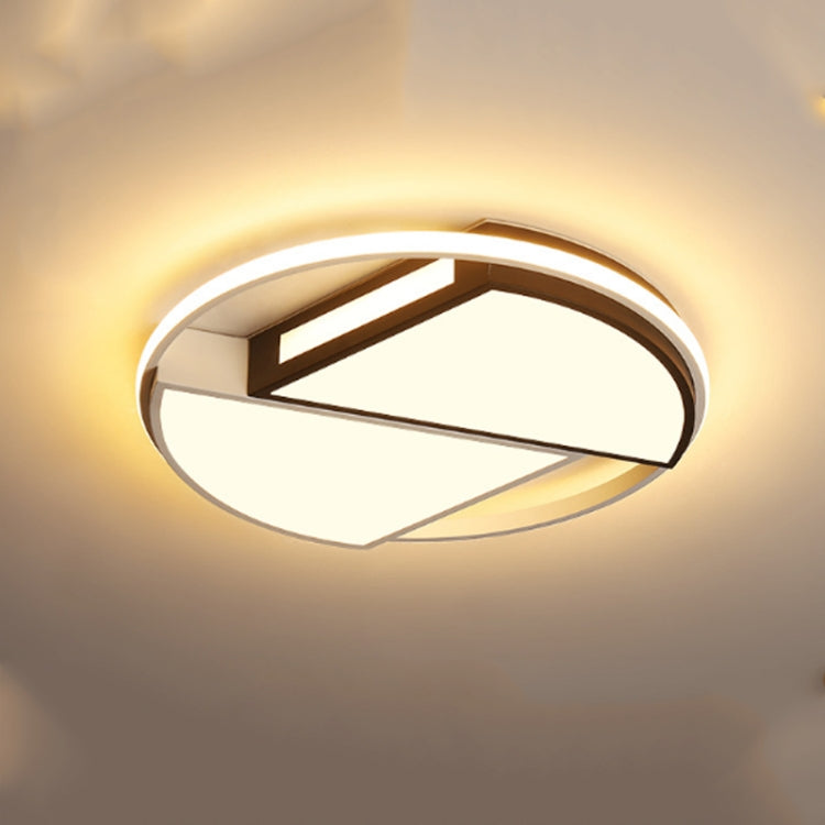 Warm light ceiling lamp with round ring and geometric inner bars in wood and black