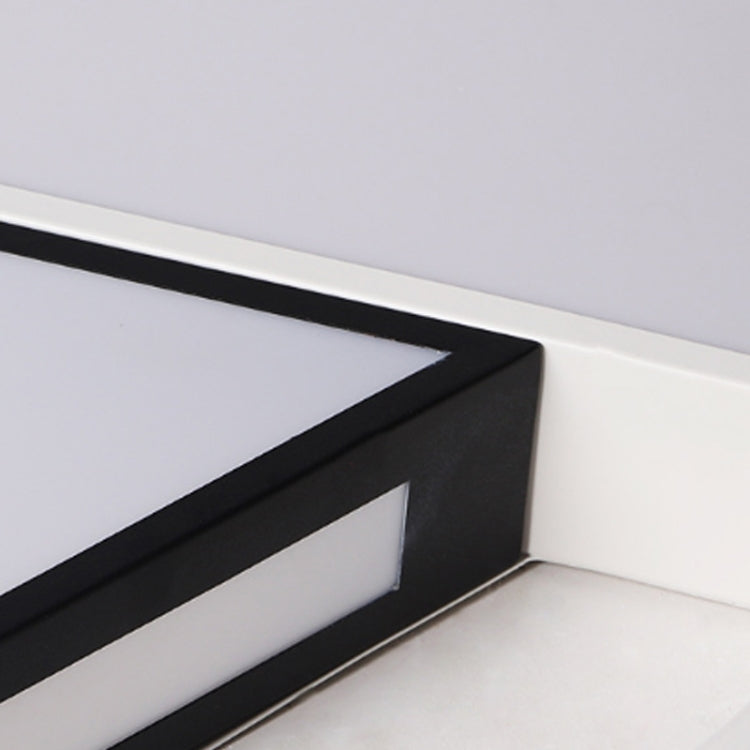 Ceiling lamp corner detail with black inner bar and white circular outer ring
