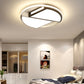 Warm white ceiling lamp in modern room with round ring and geometric inner bars