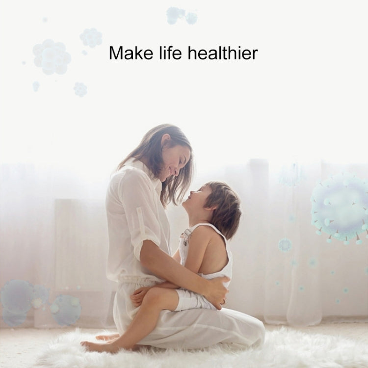 Mini anion air purifier in a clean home family scene with soft bubble effects