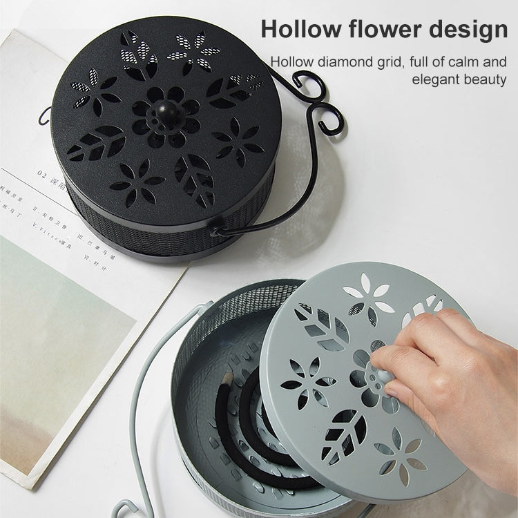 Black mosquito coil box with flower cutout lid and arched carrying handle