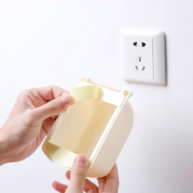 Beige outlet cover with open flap, showing socket and insertion openings
