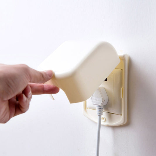 Beige plug safety cover with hinged top, sealing outlet with cable pass-through
