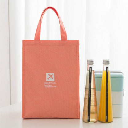 Orange insulated lunch bag tote with carrying handles, compact picnic storage.