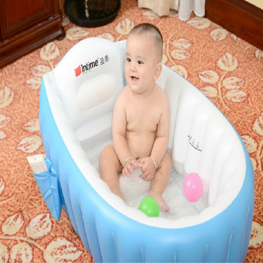 Inflatable baby bath tub with baby sitting inside and two bath balls