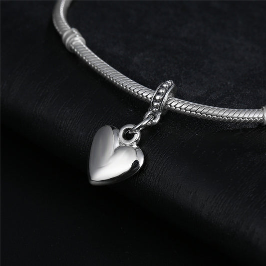 Silver heart charm bead pendant attached to a silver tone chain