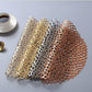 Assorted metallic round PVC lace placemats, layered in gold, silver, black, copper