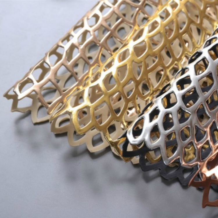 Metallic lace placemats close-up: gold, silver, black, copper tones