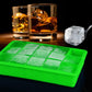 Green 15-grid silicone ice tray with square clear ice cubes