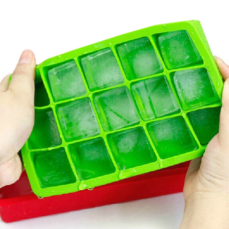 Green 15-grid silicone ice tray with square cavities, held in hands
