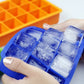 Blue 15-grid silicone ice tray with square ice cubes and frost