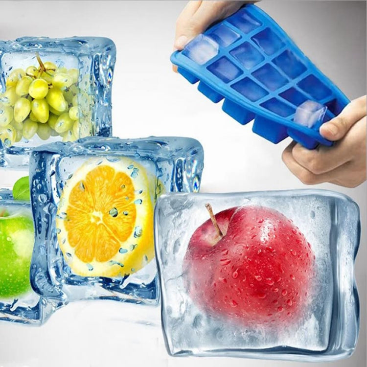 Blue 15-grid silicone ice tray with square fruit ice cubes, being held