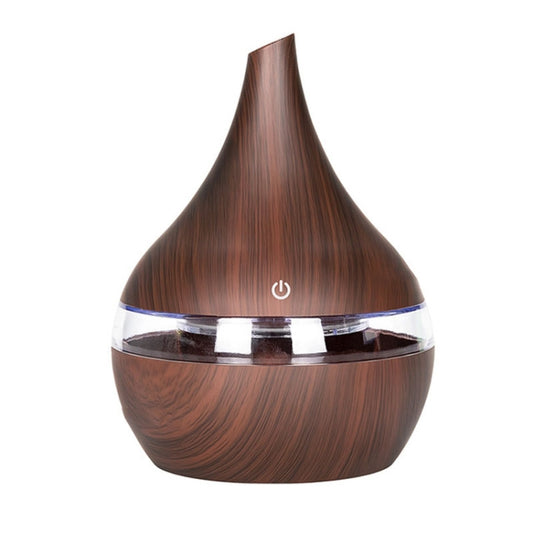 Dark wood-grain aroma diffuser with clear top ring and power button.