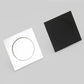 Foot-operated floor drain cover with circular button, black and white square plates