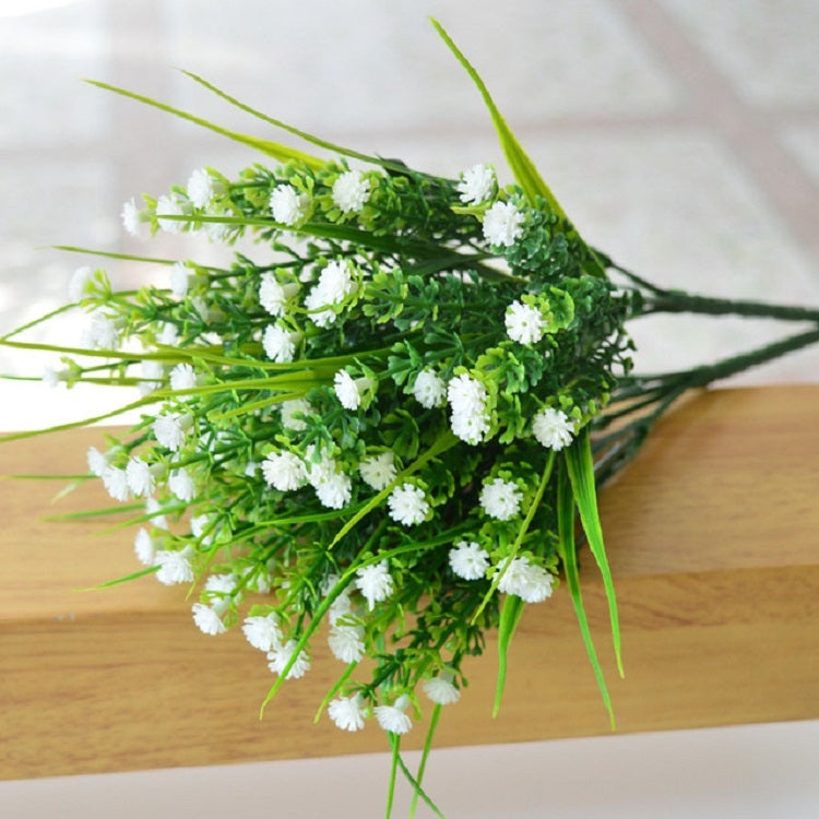 White simulation flower bouquet with small clustered starry blossoms and green stems
