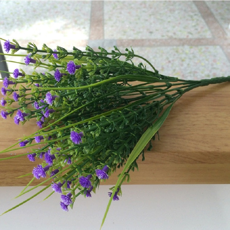 Purple simulation flower bouquet with small clustered blossoms on green stems